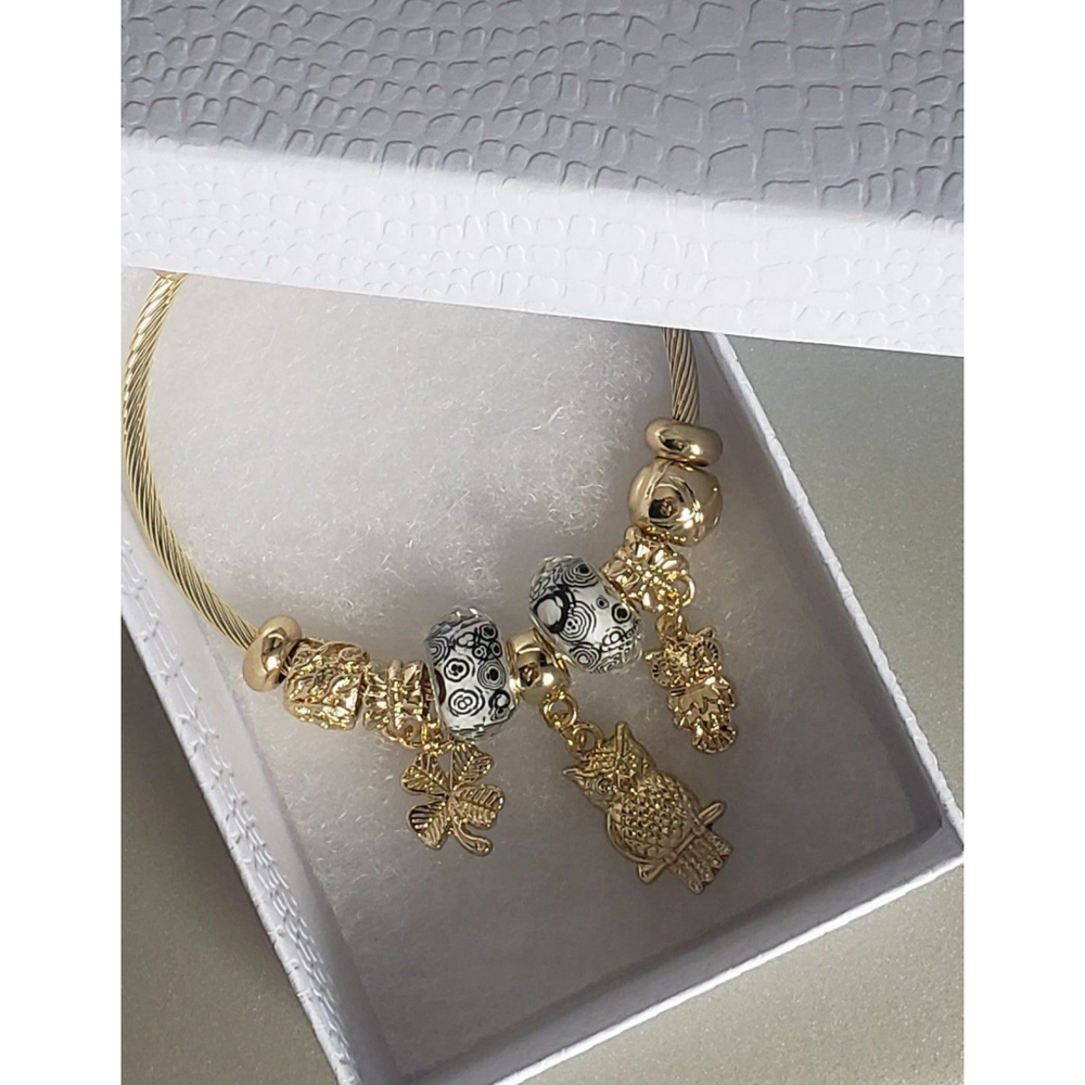 18k Gold Finish Stainless Steel Titanium Flex Bracelet\nOwls/Clover/Butterfly